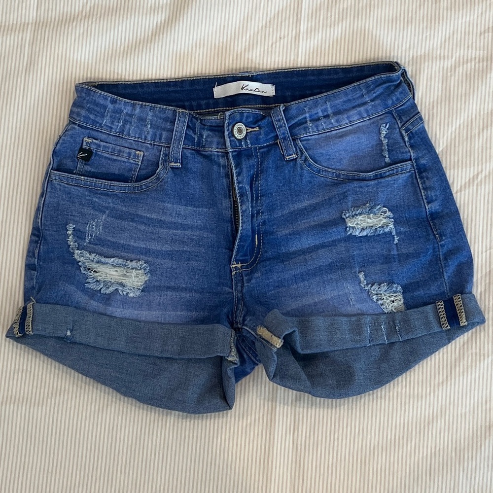 Mid rise denim shorts. Size 26. Stretchy material.